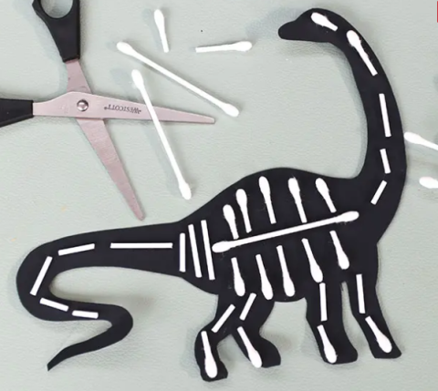 dinosaur silhouette with cotton swabs for bones