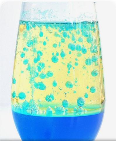 glass jar with floating blue orbs