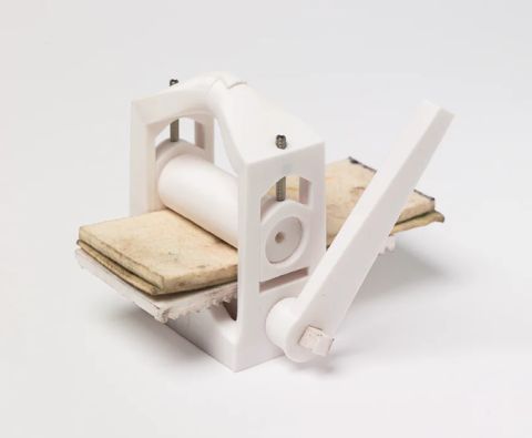 An image of a mini 3D-printed printing press