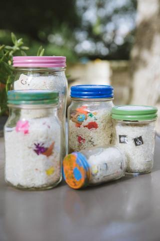 Jars filled with rice and trinkets.  