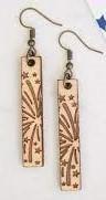 Wooden earrings with fireworks on them