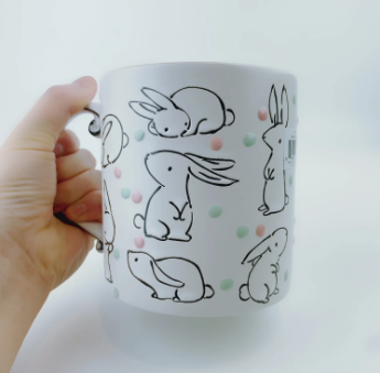 Ceramic mug with polka dots and bunnies on it