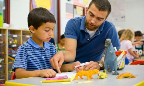 child and adult males engaged in STEAM activity