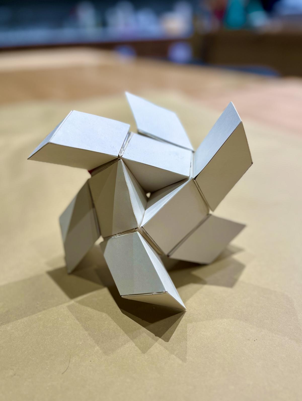 An image of a geometric scuplture constructed from paperboard.