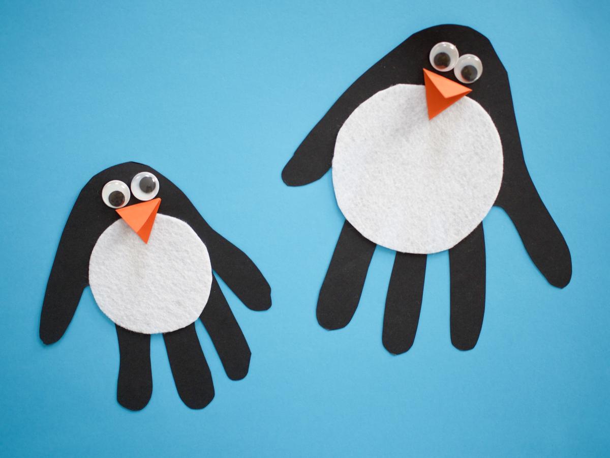 Penguin craft using shape of hand other creative materials. 