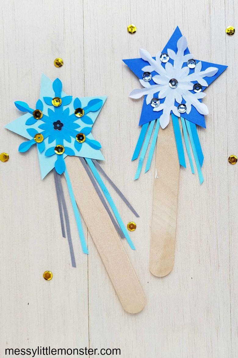 Snowflake wand using popsicle stick and other matierals.