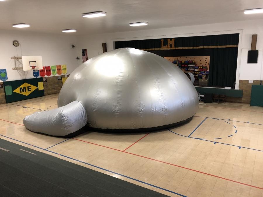 image of inflatable star dome in school gymnasium