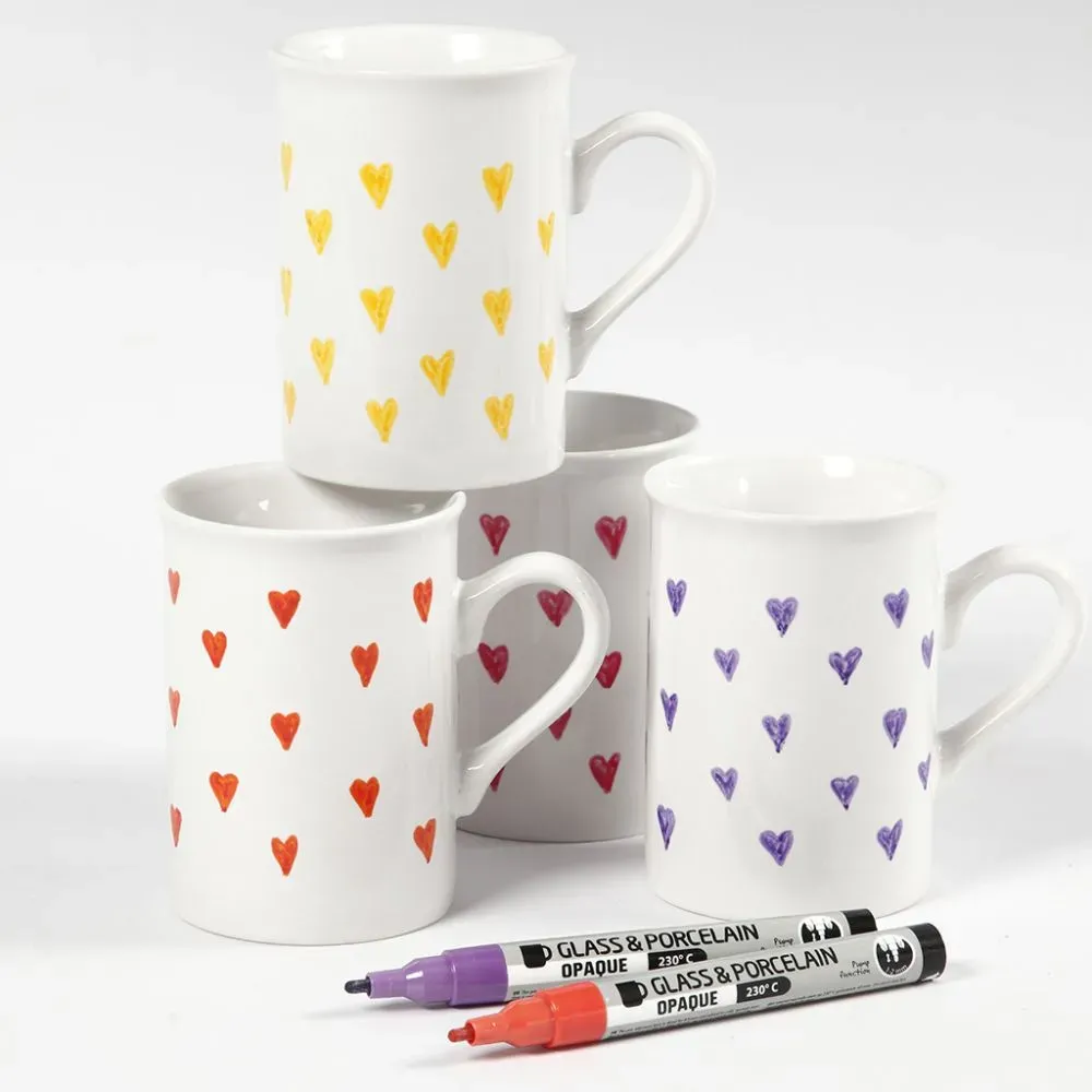 mugs with hearts drawn and markers