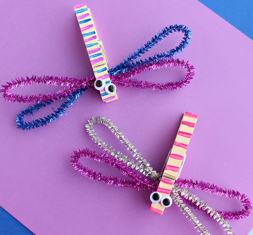 dragon flies made from clothespins and pipe cleaners with paint and googly eyes