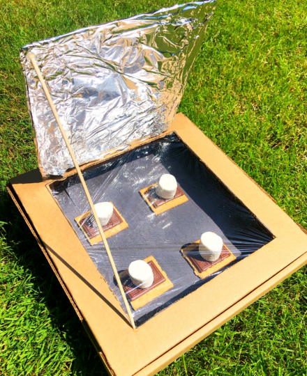 Solar oven which uses a pizza box, aluminum foil, and ingredients for s'mores.  