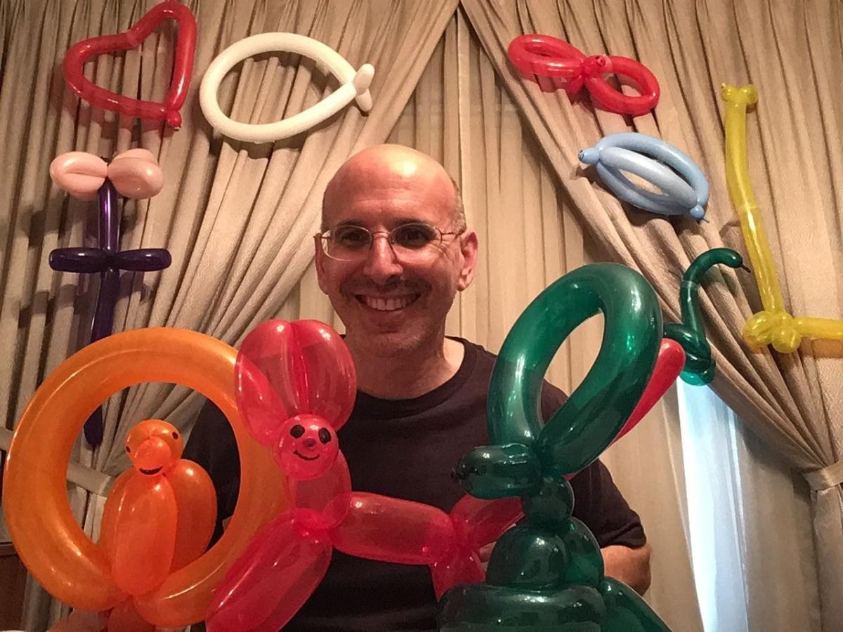 man with balloon animals