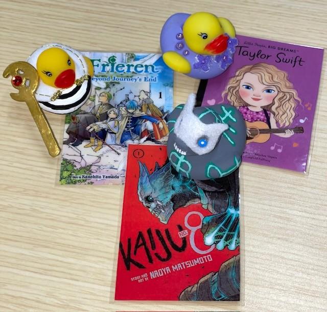 Frieren, Taylor Swift, and Kaiju no8 duckies